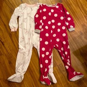 Two pairs of fleece, footed pajamas by Carter’s